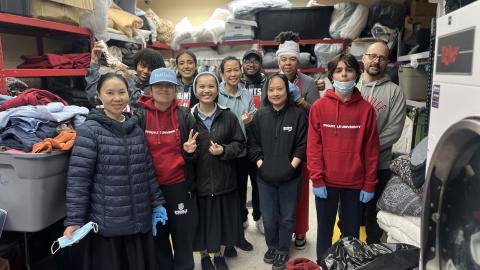 large group of people smiling at the camera