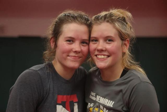 Hannah McCarley and Brenna McCarley posing together at wrestling club